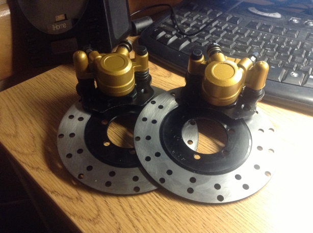 New rotors and brake calipers. These are from a Hammerhead buggy. Massive brakes on a small kart. 